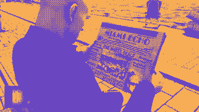 Agent 47 reads the newspaper